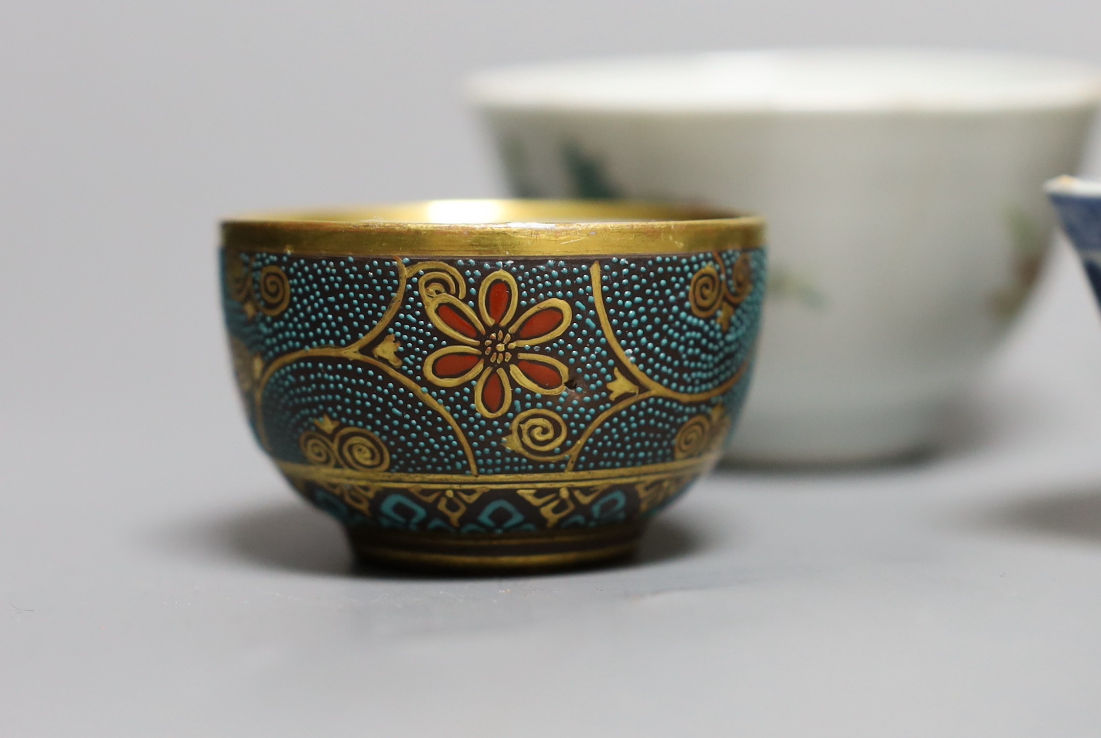 A Chinese Dehua libation cup, eight 18th century and later Chinese porcelain tea bowls and a Kutani tea bowl